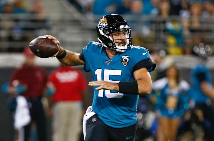 Jacksonville Jaguars quarterback Gardner Minshew (15) drops to throw a pass during the second half against the Tennessee Titans at TIAA Bank Field.